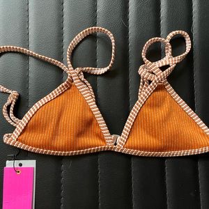 Never been worn before. Still new with tags. Really cute and perfect for summer.